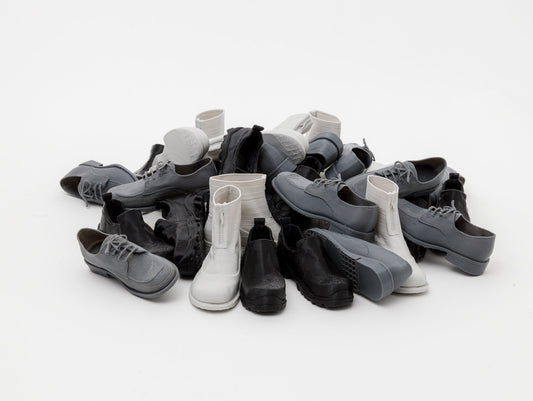 3D‑printed miniatures capturing every detail of our models: Cove Boot, Non Safety Slip-on & Buster Brown.