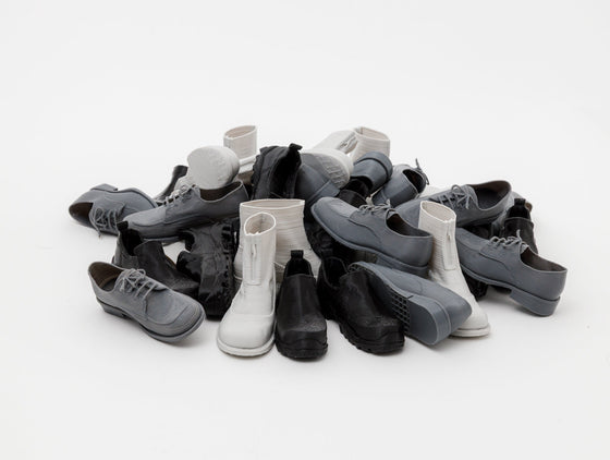 3D‑printed miniatures capturing every detail of our models: Cove Boot, Non Safety Slip-on & Buster Brown.