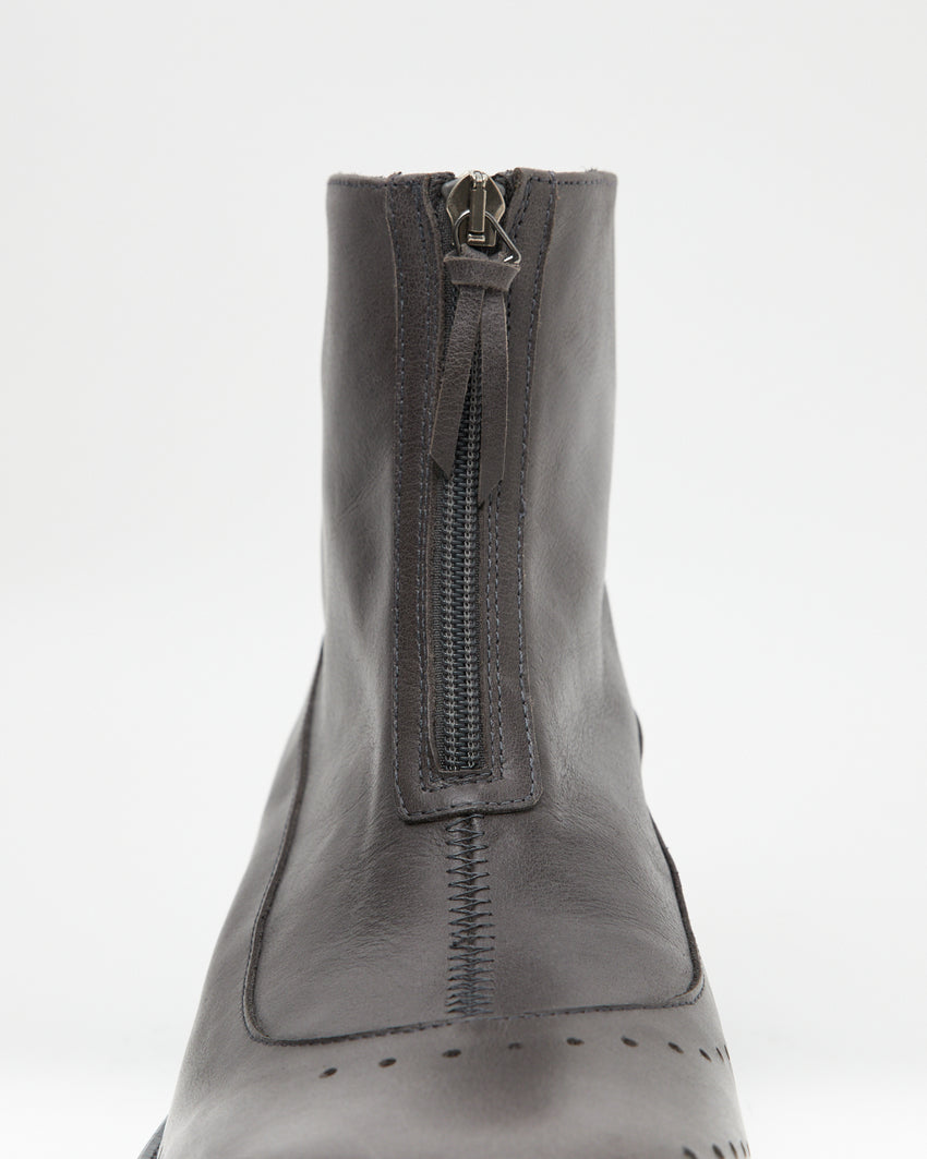 Close-up straight-on front view of the Cove Boot Jeongli Grey shaft showing the zip pull