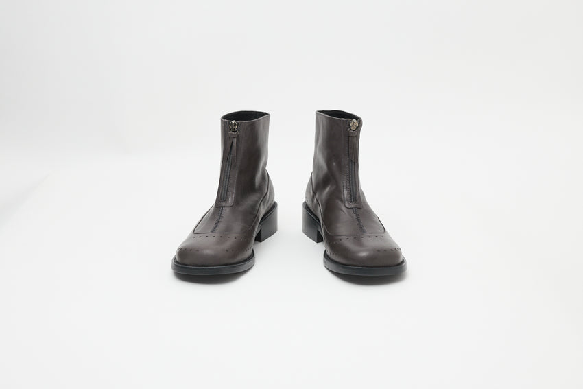 Pair of Cove Boot Jeongli Grey boots standing apart, front-facing view at a distance