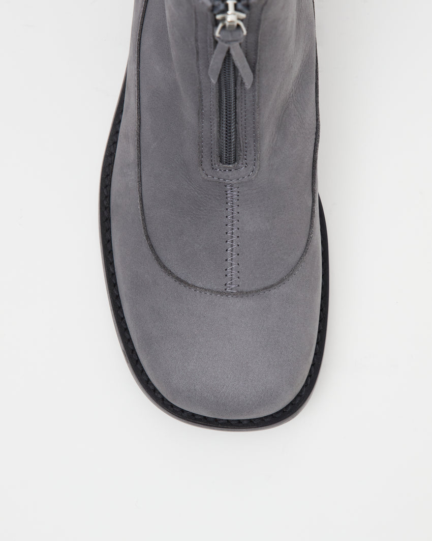 Close-up top-down view of a single Cove Boot Nubuck Ink Blue boot showing the zipper pull