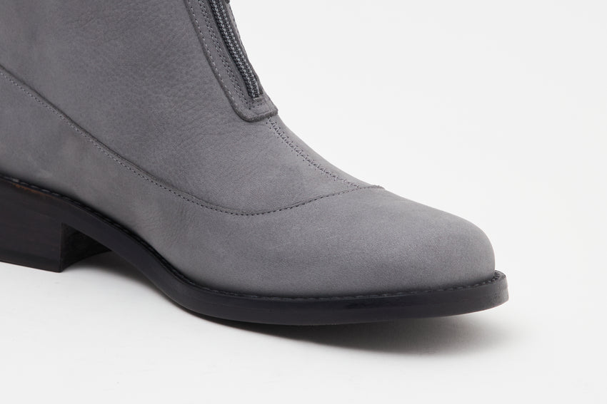 Small side profile view of a single Cove Boot Nubuck Ink Blue boot