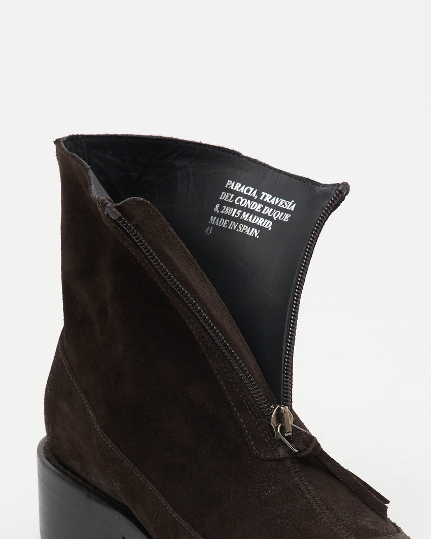 Close up shot of zipper and interior label on Cove Boot in dark brown wax-treated suede.