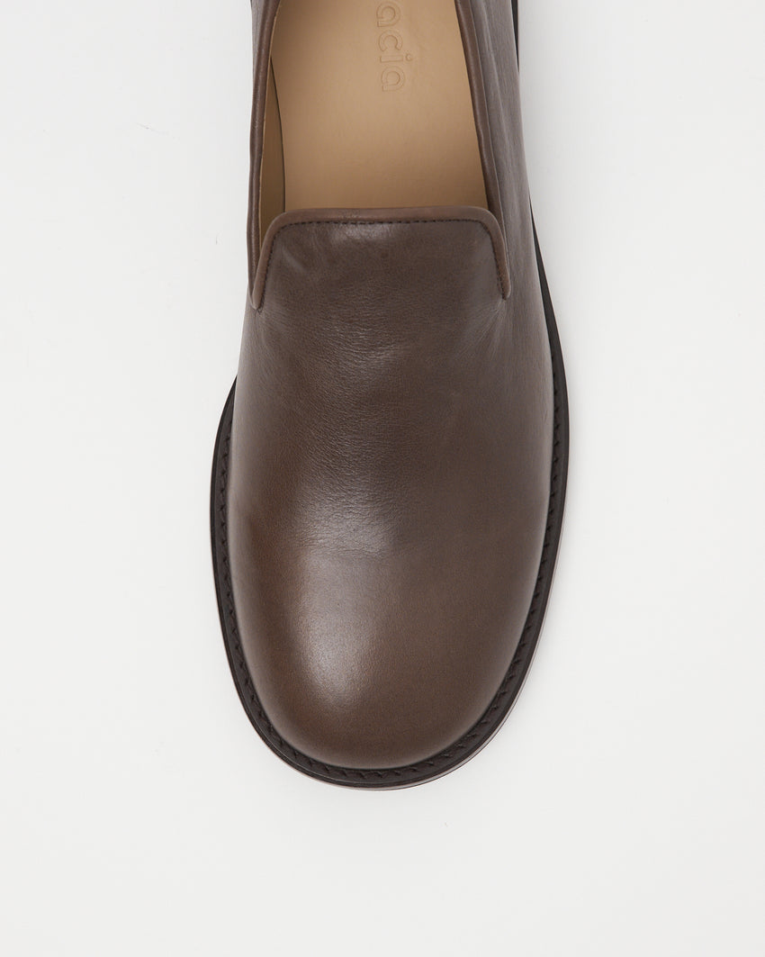 Top-down view of Legacy Slipper in brown oil nappa leather, showing rounded toe and smooth upper.
