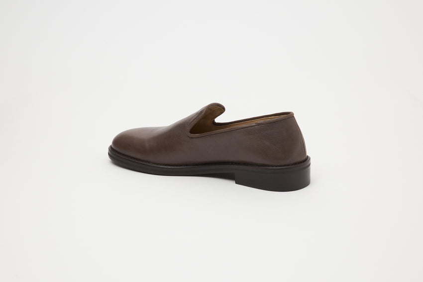 Rear three-quarter view of single Legacy Slipper in brown oil nappa leather by Paracia.