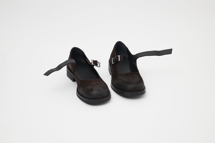 Small side-by-side view of a pair of Mary Jane Waxed Suede Deep Brown shoes showing buckle straps