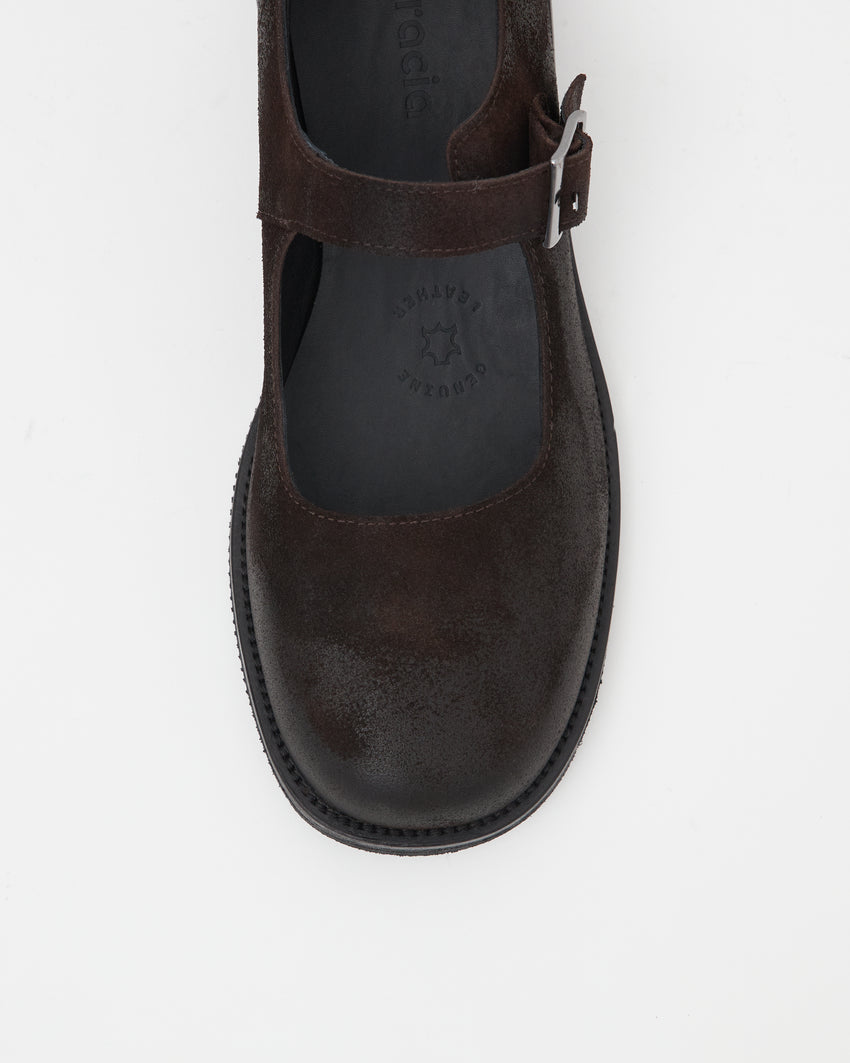 Close-up top-down view of a single Mary Jane Waxed Suede Deep Brown shoe showing rounded toe and buckle strap