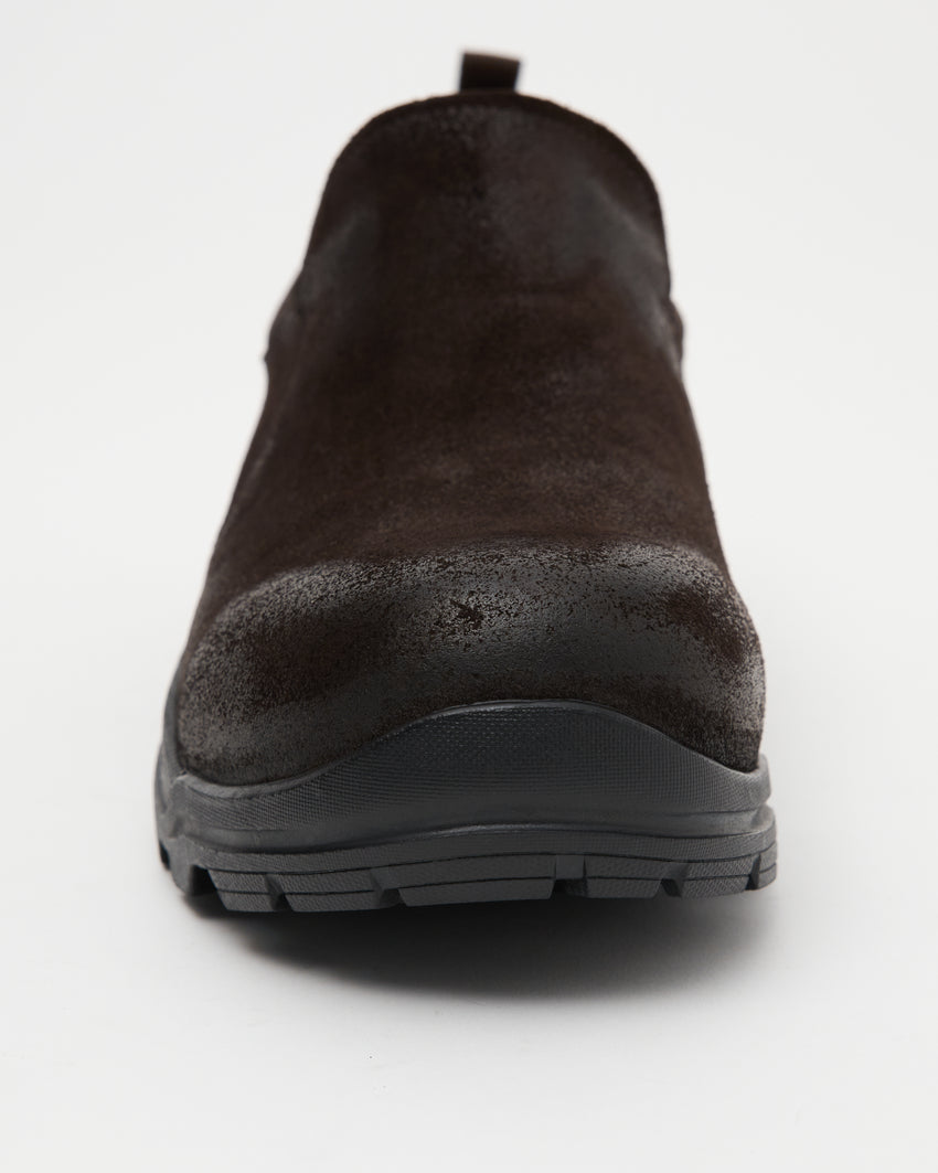 Close-up angled top-down view of a single Non-Safety Slip-on Waxed Suede Deep Brown shoe showing black interior collar and lugged sole