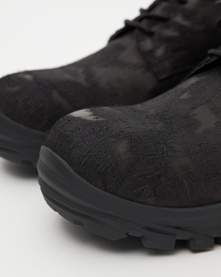 Close-up angled front view of a pair of Non-Safety Shoe Distressed Leather Black shoes showing distressed texture and lugged sole