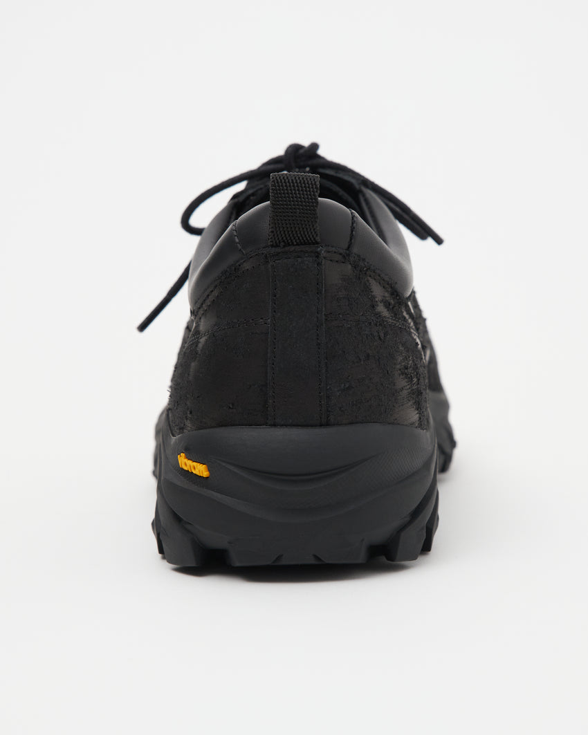 Close-up front view of a single Non-Safety Shoe Distressed Leather Black shoe showing laces and lugged sole