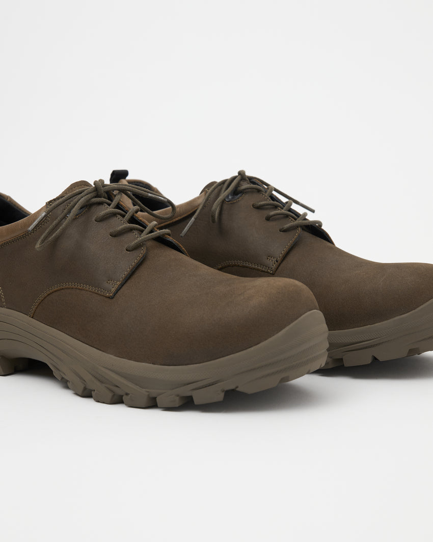 Close-up angled front view of a pair of Non-Safety Shoe Nubuck Brown Stone shoes showing laces and lugged sole