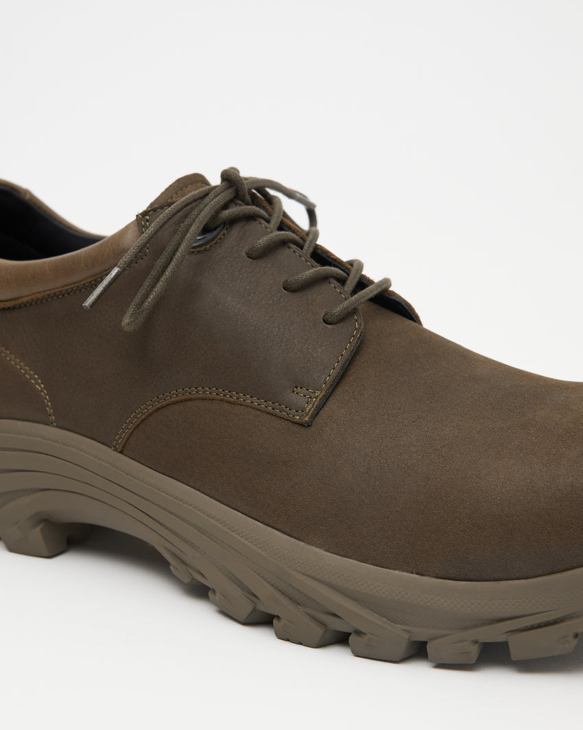 Close-up side view of a single Non-Safety Shoe Nubuck Brown Stone shoe showing the lugged sole