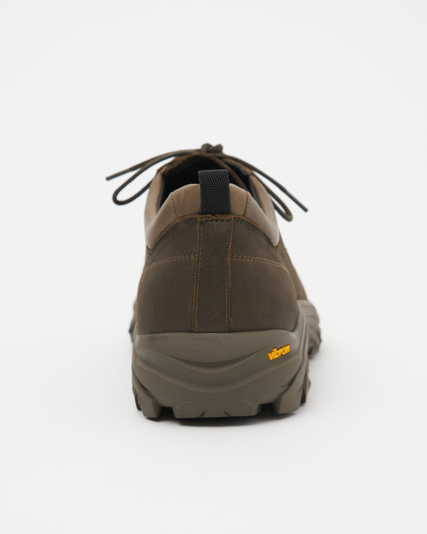 Close-up angled front view of a single Non-Safety Shoe Nubuck Brown Stone shoe showing laces and Vibram sole tag