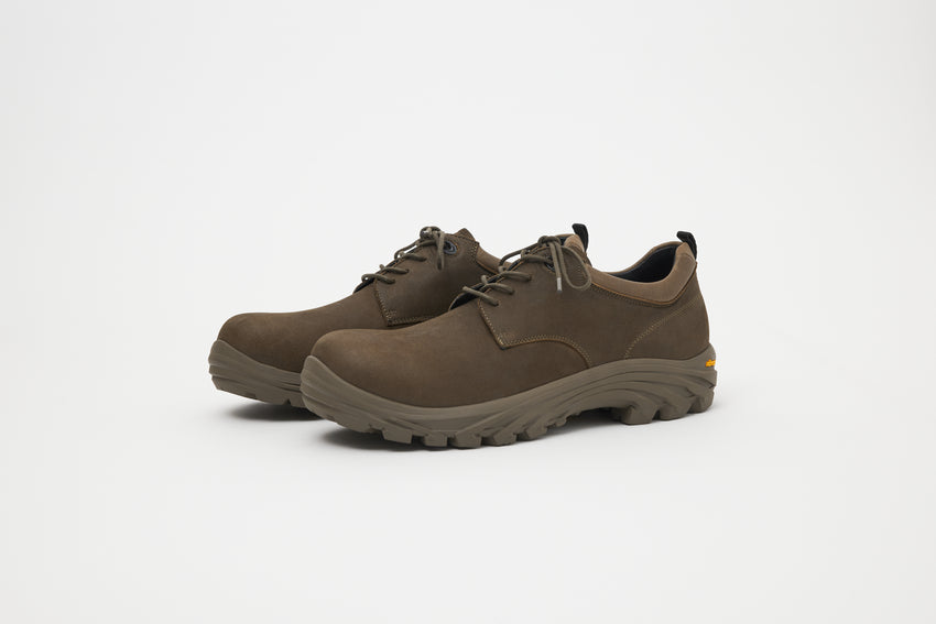 Close-up angled front view of a pair of Non-Safety Shoe Nubuck Brown Stone shoes showing laces and black interior collar