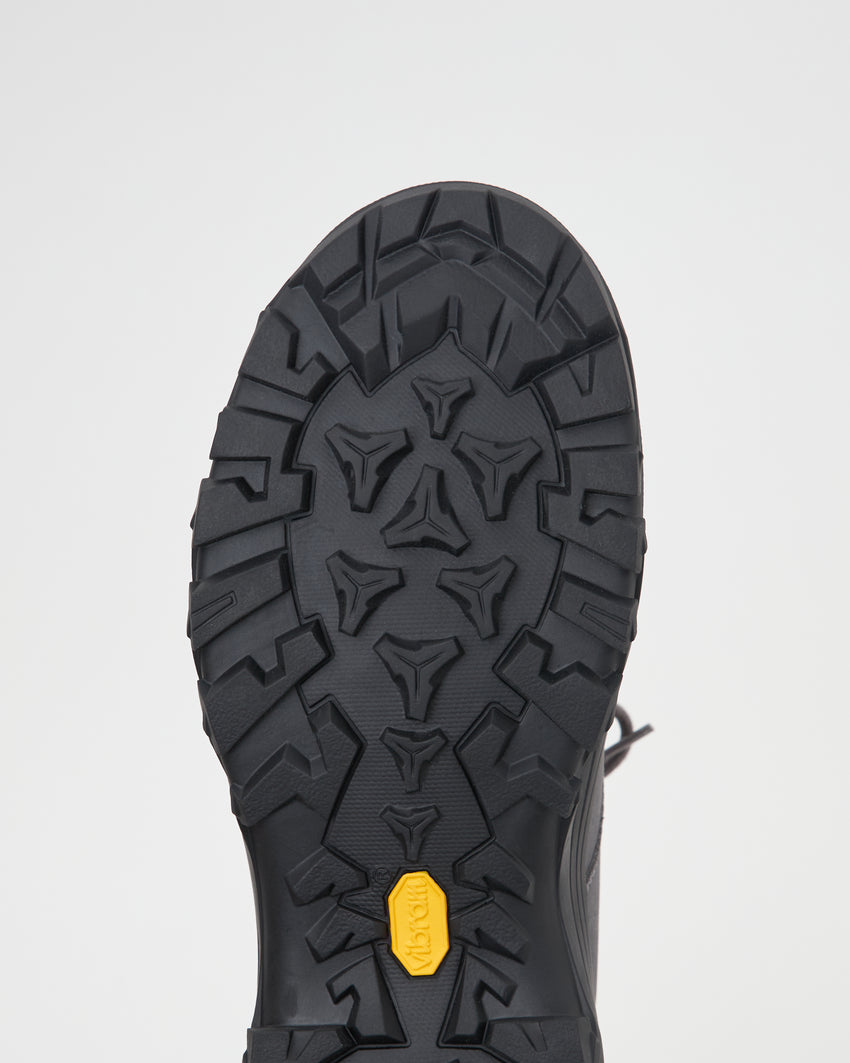 Close-up of Non-Safety Shoe Nubuck Ink Blue outsole showing tread pattern with yellow accent