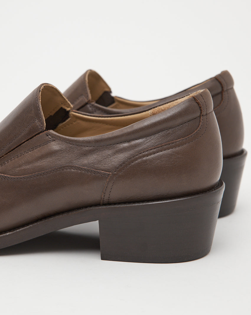 Close up of Pedal Loafer in rich brown oil nappa leather heel construction.
