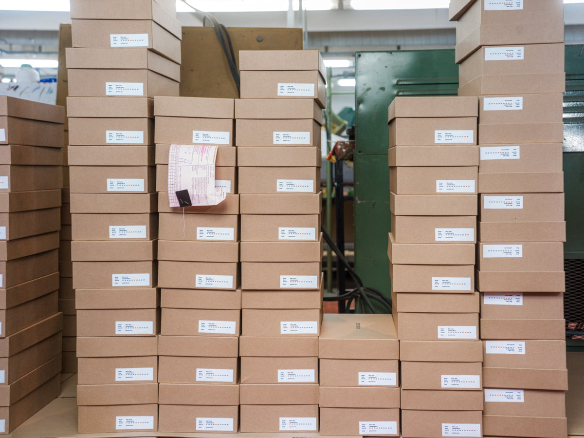 Stacks of paracia shoe boxes at the factory